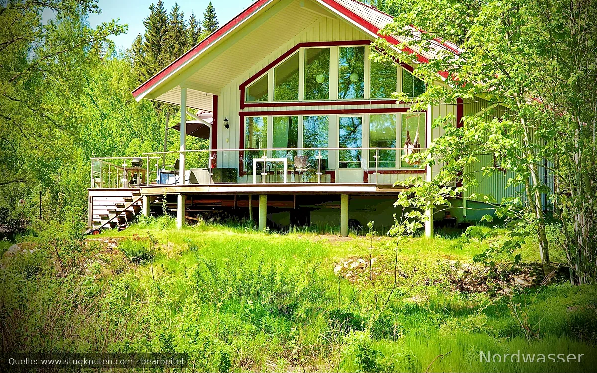 Hus vid Värmelns strand i Värmskog-Värmland