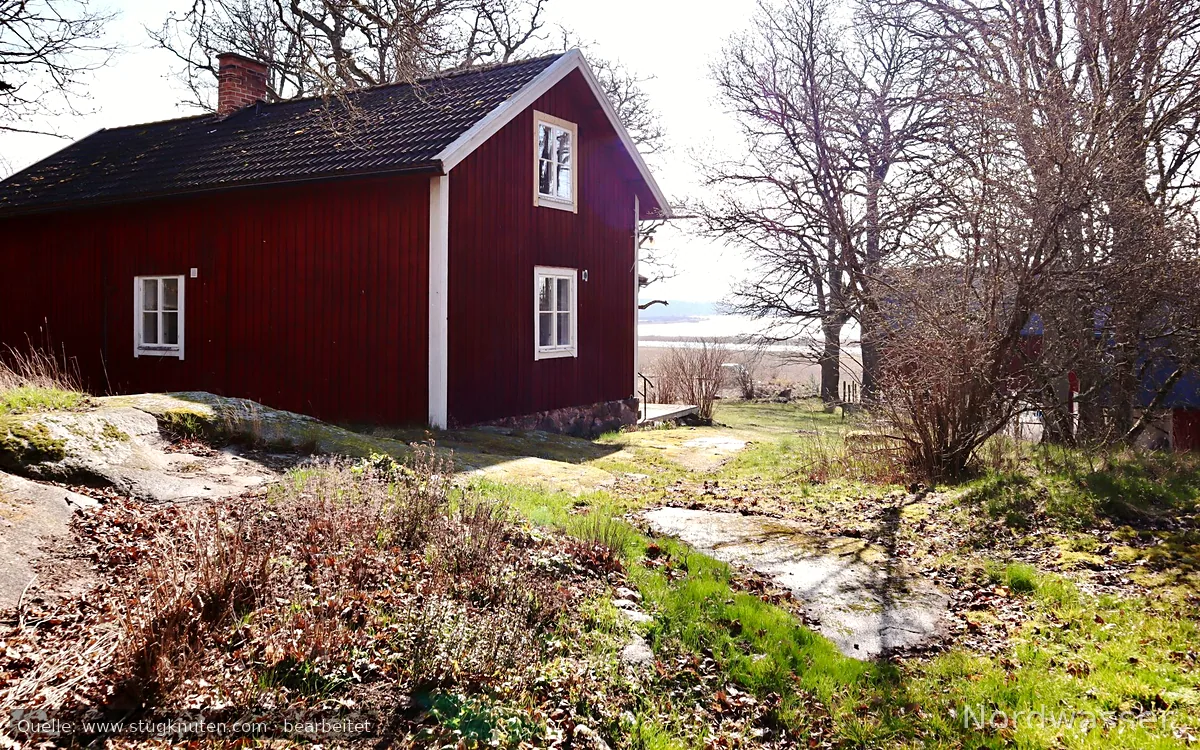 Röd stuga på Lindeborgs Eco Retreat och gård